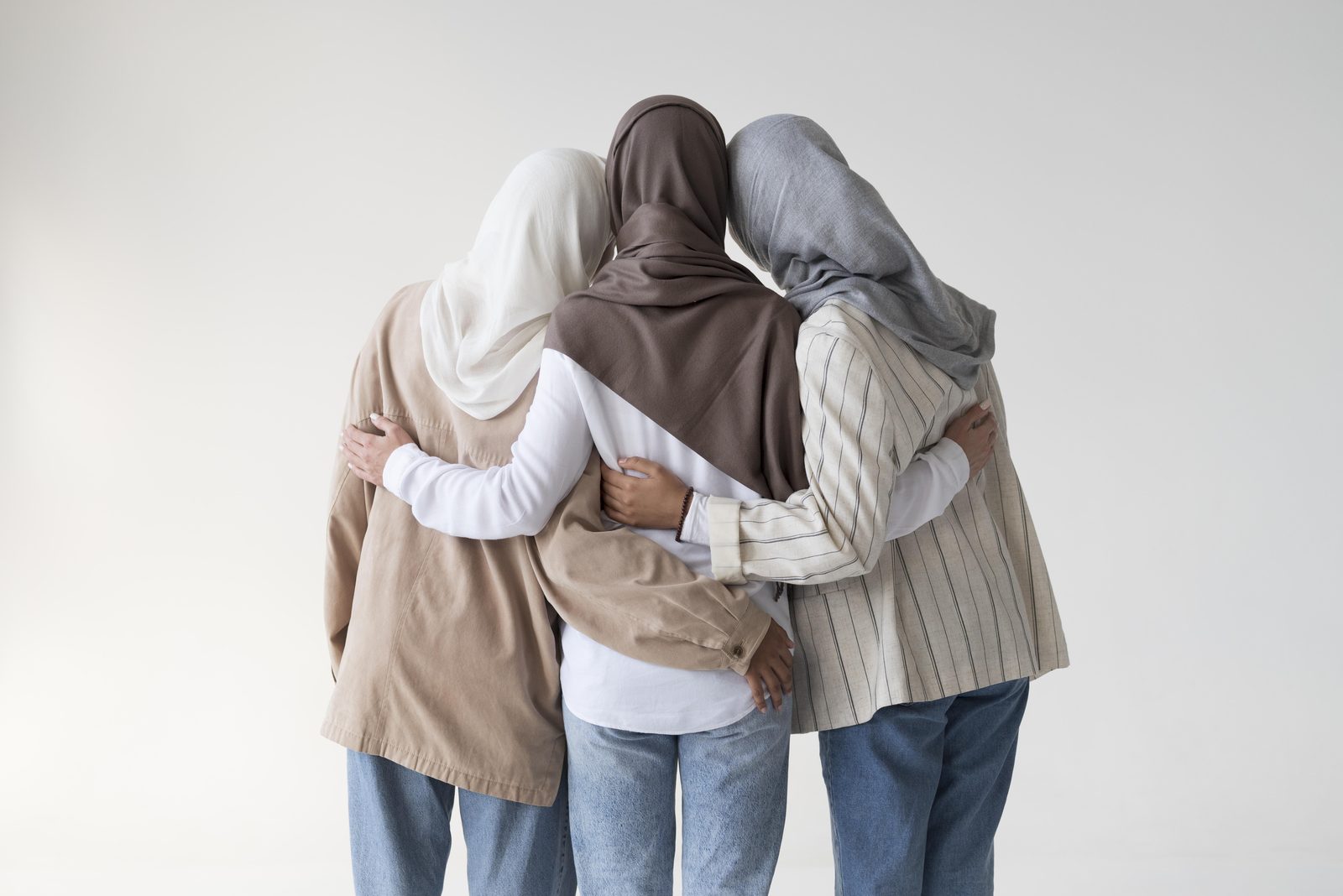 Young Muslim women embracing — community and belonging