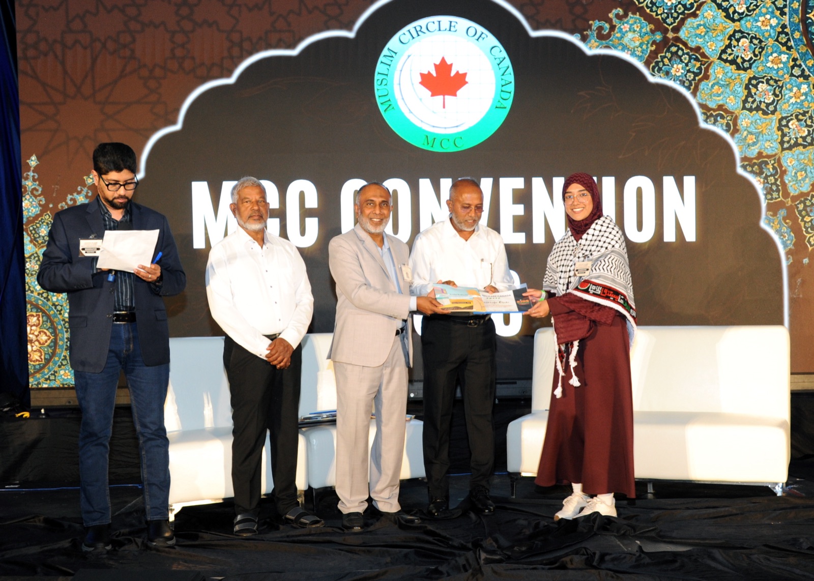 A NextGen youth receives a book award