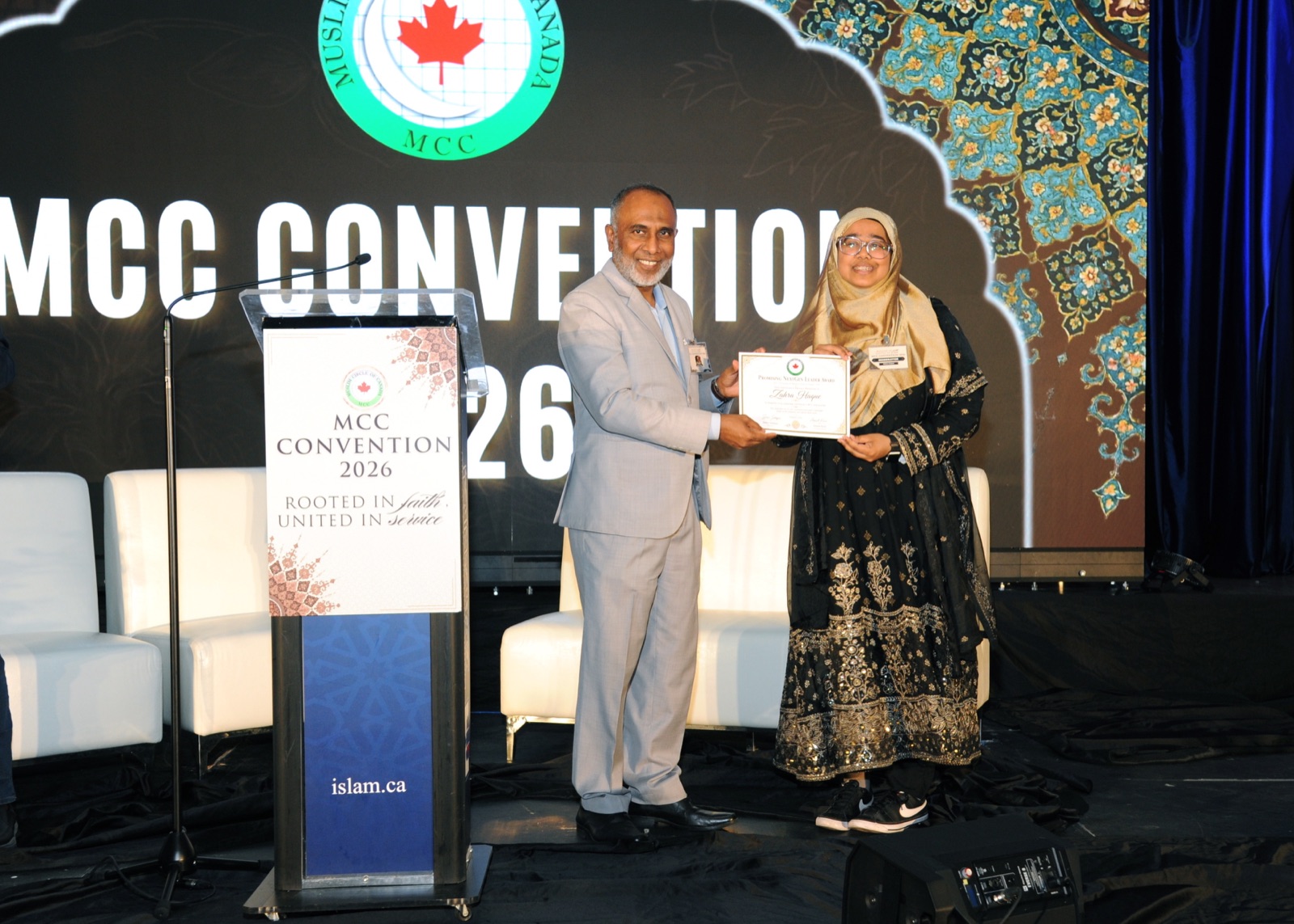 A NextGen Leader award recipient is honoured on stage