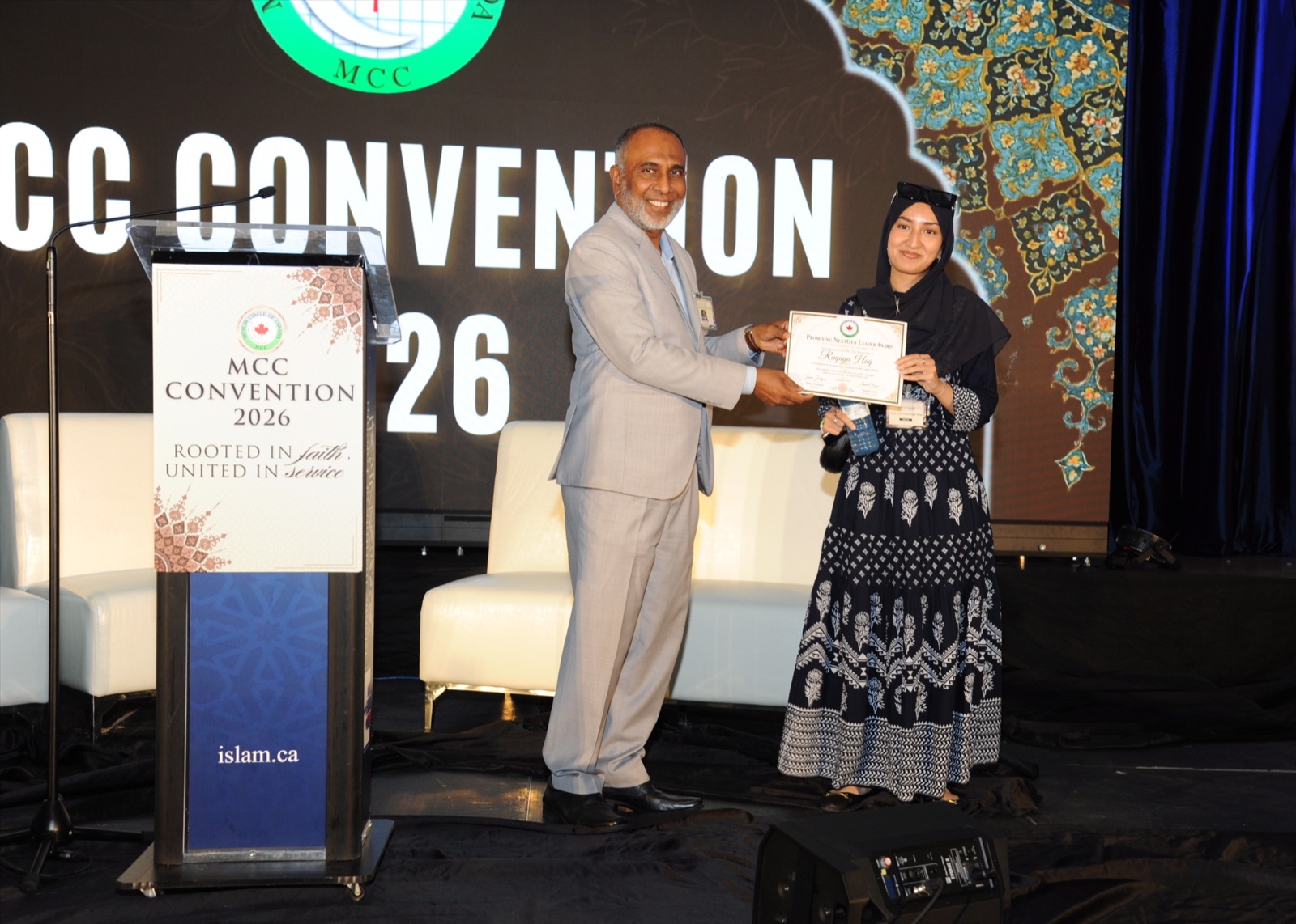 A NextGen Leader award is presented on stage