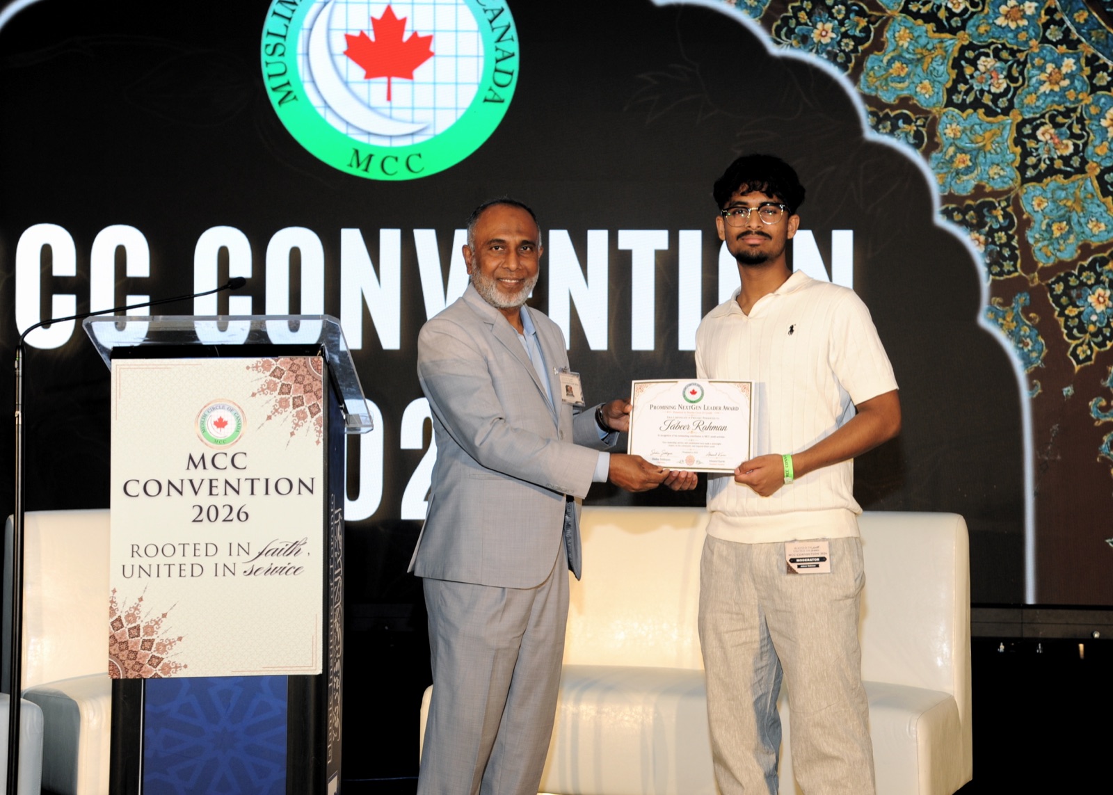 A NextGen Leader award is presented at the podium