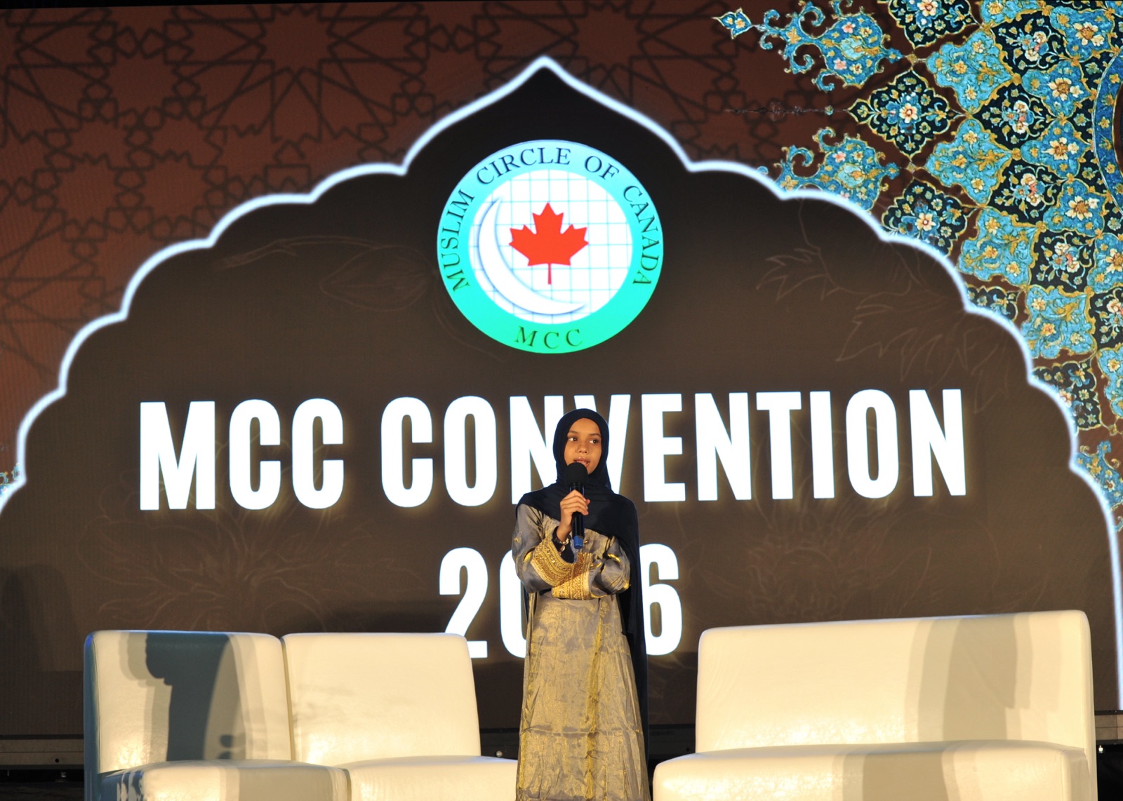 A junior-youth speaker addresses the hall